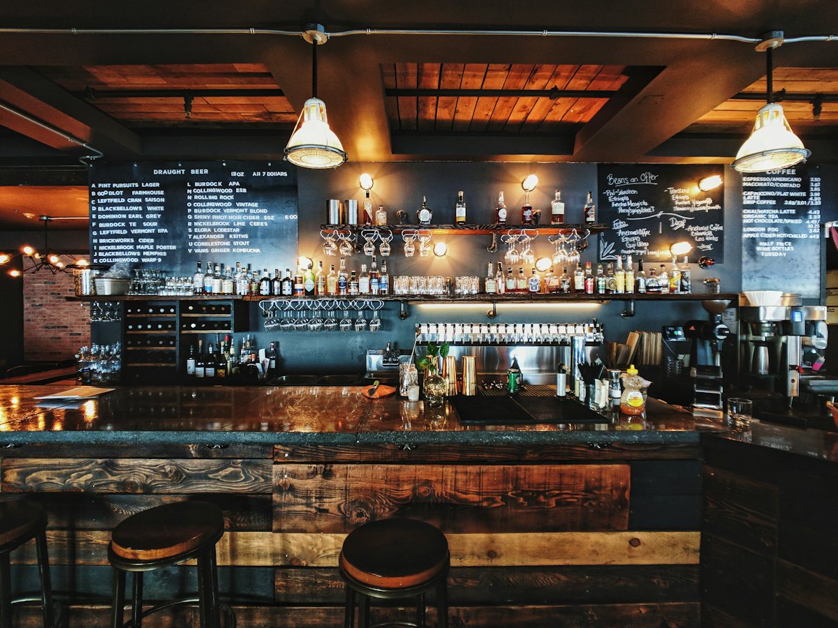 The bar at Marrow and Sage, with chalkboard menus and low lamps